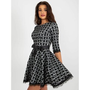 Black flowing cocktail dress with lace