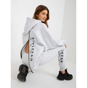 Light grey women's tracksuit with inscriptions and zippers