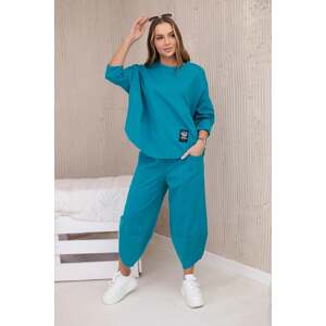 Loose women's set of trousers and blue-green sweatshirt