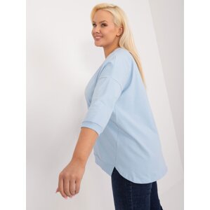 A light blue plus-size blouse with slits